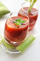 Tomato juice in glasses and celery