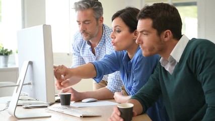 Business people working on desktop computer - Powered by Adobe