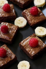 Banana chocolate Brownies on black background