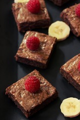 Banana chocolate Brownies on black background