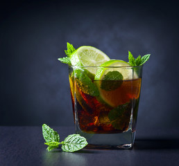  cocktail Cuba libre with lime and peppermint leaves
