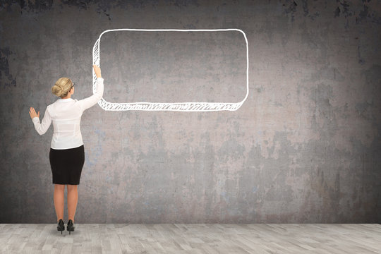 Business woman drawing on the wall. business concept
