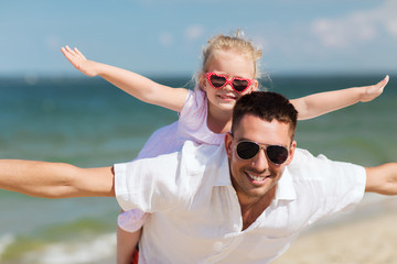 happy family having fun on summer beach