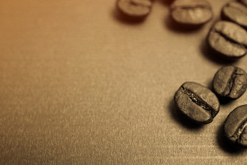 Fototapeta na wymiar coffee beans on vintage color paper background
