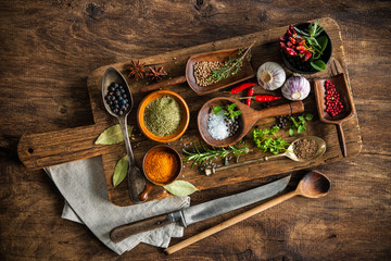 Colorful spices on wooden table