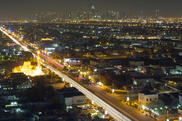 Fototapeta na wymiar Dubai night city skyline with modern skycrapers, UAE