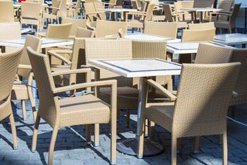 empty tables in street cafe