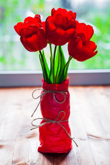 Colorful tulips on wooden table