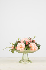 Rose arrangement with copy space, in vertical format.
