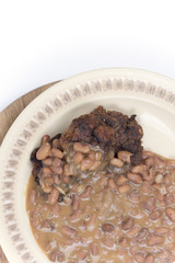 Cooked beans with meatballs served on the plate