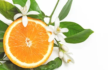 Zelfklevend Fotobehang Half Orange Fruit with leaves and blossom isolated on white back © Shootdiem