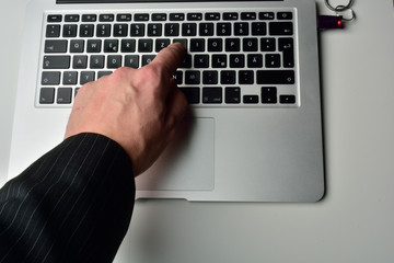 typing on laptop computer