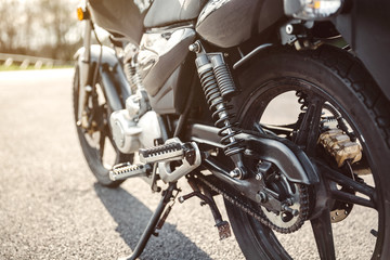 Shock absorber and chain of black motorcycle 