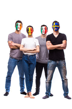 Group of football fans support their national team: Belgium, Italy, Republic of Ireland, Sweden at camera on white background. European football fans concept.