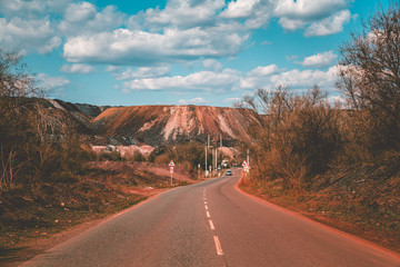 road with mine on the background