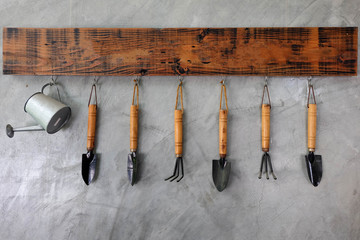 Gardening tools hanging on the wall.