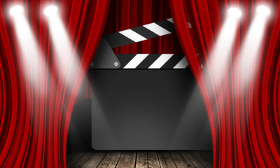 Movie clapperboard on a red