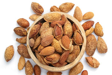 Group of almond nuts isolated on a white background.