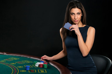 Fototapeta na wymiar sexy woman with poker cards and chips
