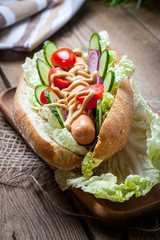 Homemade sandwich on a wooden table.