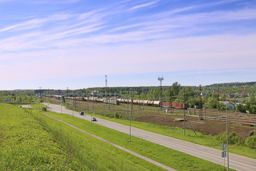Fototapeta na wymiar Freight trains with tanks stand on railway station