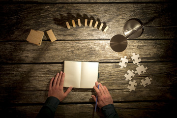 Top view of male hands about to make notes in blank notebook - obrazy, fototapety, plakaty