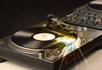 Music player playing vinyl with glow lines comming from the need