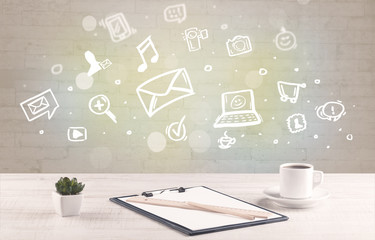 Office desk with communication icons