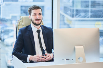 Portrait of a businessman sitting on the workplace