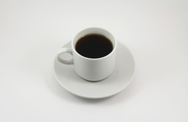Cup of black tea on white background