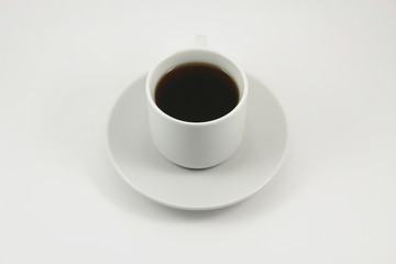 Cup of black tea on white background