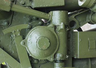 military green background with part of the gun