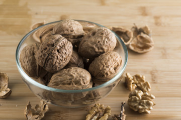 pile of walnuts in the foreground represent a healthy diet