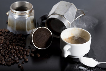 Traditional Italian coffee in the foreground with coffee already