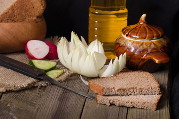 The cut vegetables on an old wooden table