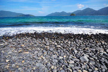 Fototapeta na wymiar Pebbles on beach, Andaman Sea, Thailand