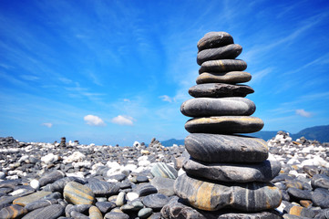 Stack of pebbles on beach, Andaman Sea, Thailand
