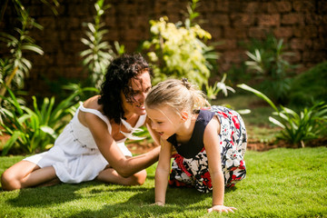 Fototapeta premium mother and preteen daughter summer portrait in the green beautiful park