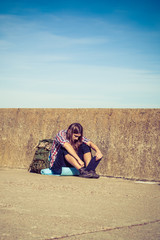 Fototapeta premium Man tourist backpacker sitting with tablet outdoor