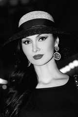 Beautiful woman portrait wearing hat black and white