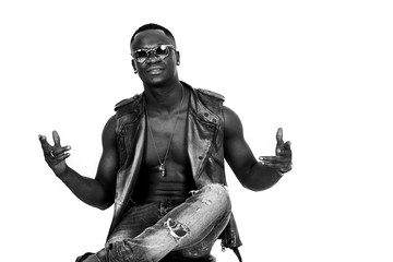 Fototapeta premium Handsome african man portrait sitting and gesturing black and white