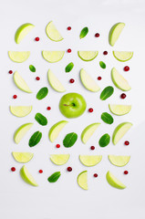 Apple and lime cutting on a white background. Food pattern . Fruit pattern.