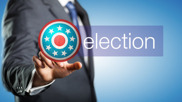 businessman pressing an election button