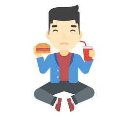 Man eating hamburger. 