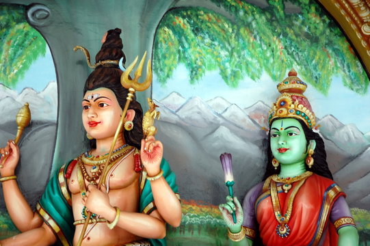 The sculptures of Shiva and Parvati  in Hindu temple. Kuala Lupmur, Malaysia