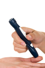 Doctors hand holding glucose measure scanning pen on patients finger with white background