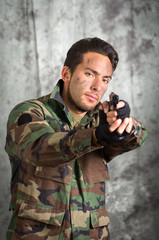 soldier militar latin man pointing a gun