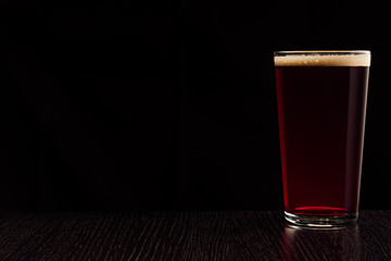  The beer red ale. The dark background.