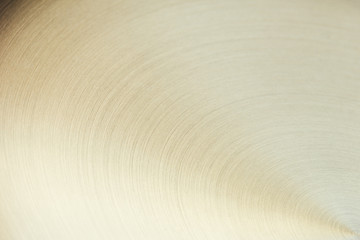 The golden surface with curved lines. The background.