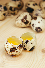  The quail eggs on a wooden board. The rustic still life. The background.